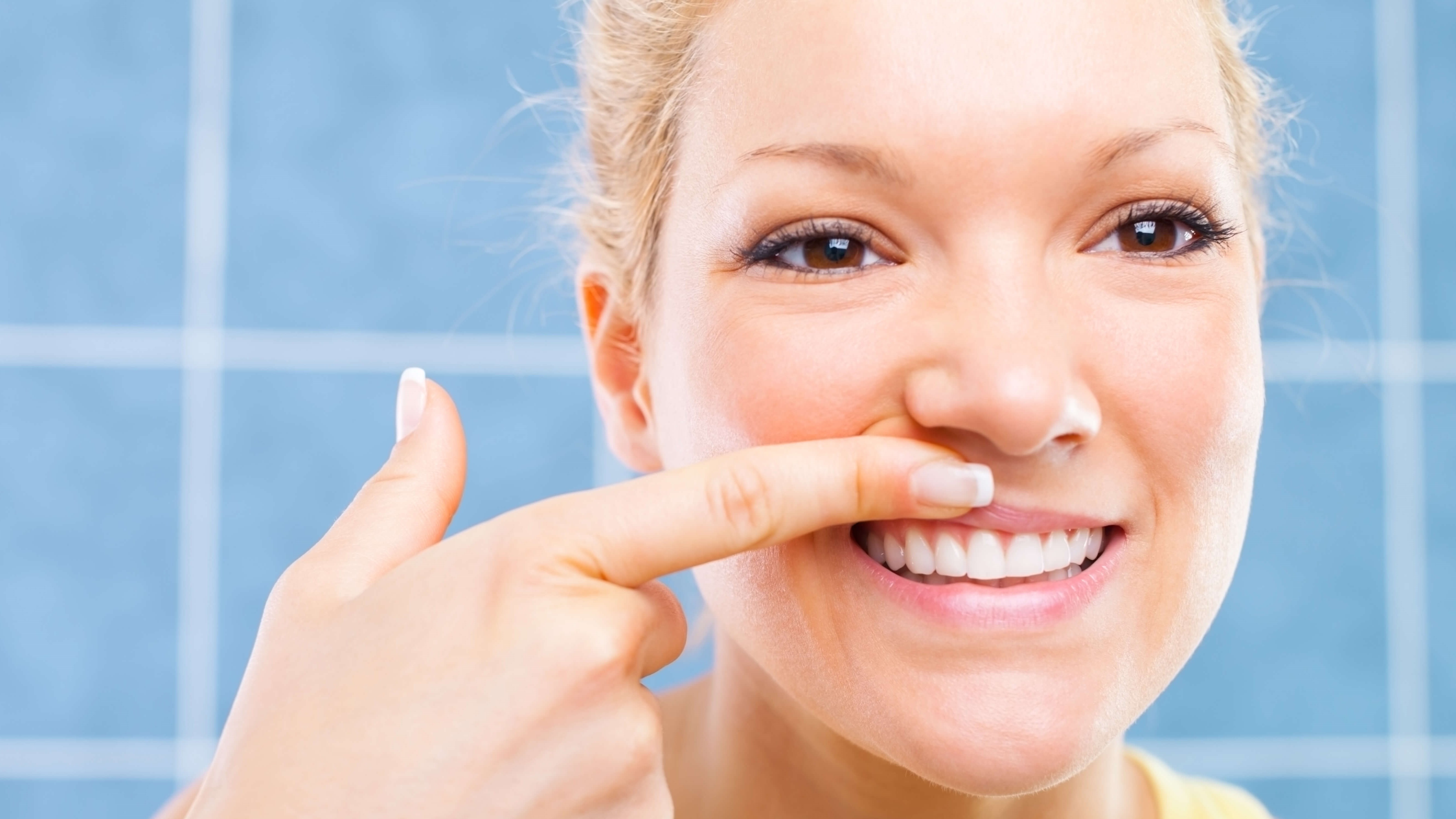 woman looking at her teeth